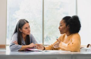 Leader having a respectful coaching conversation with a team member