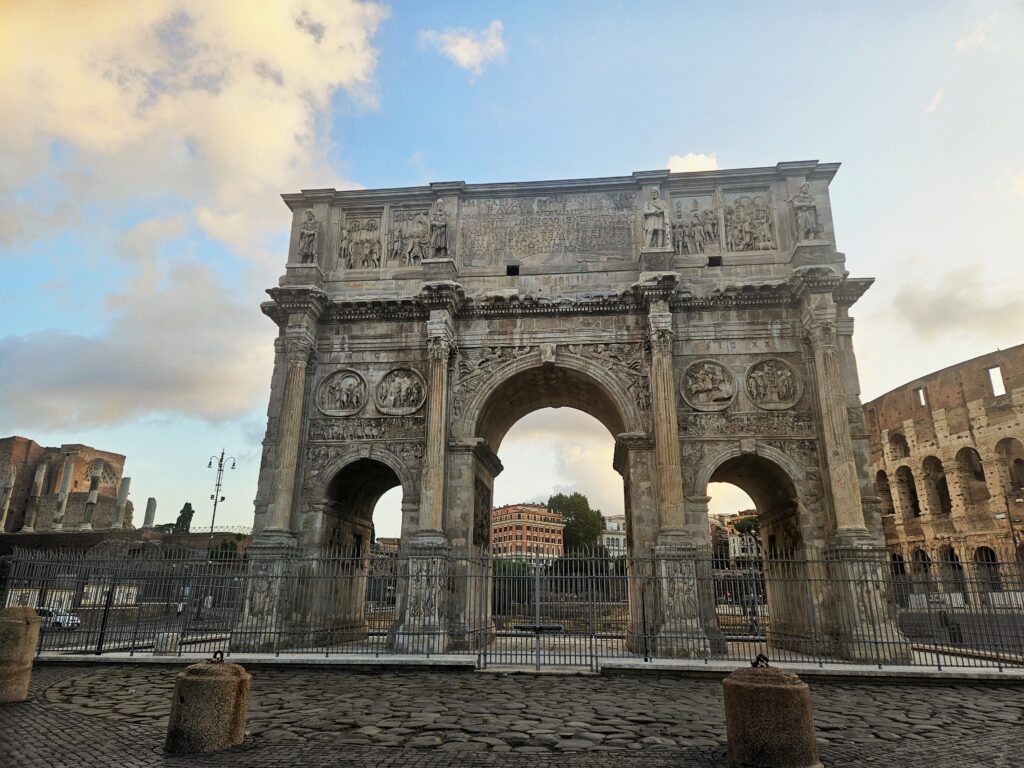Arch of Constantine beside the Colosseum in Rome during an early morning visit.